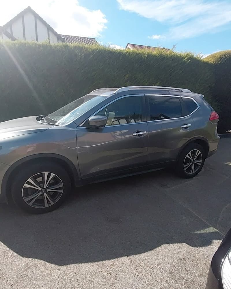 Side view of the same grey Nissan X-Trail, bodywork and alloy wheels clean