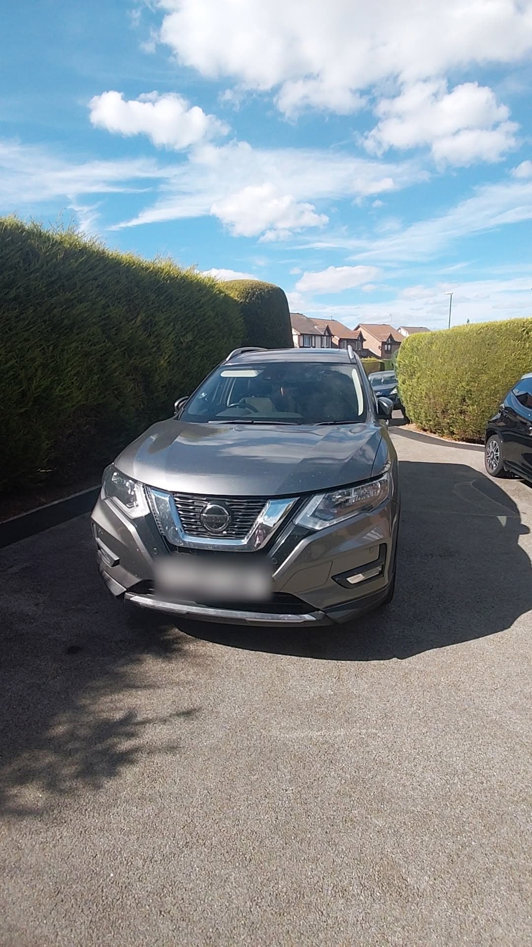 Grey Nissan X-Trail, washed, parked on a driveway between hedges in Nottingham NG8